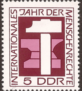 One of a number of East German postage stamps commemorating International Human Rights Year 1968. The hammer and anvil represent the right to work.